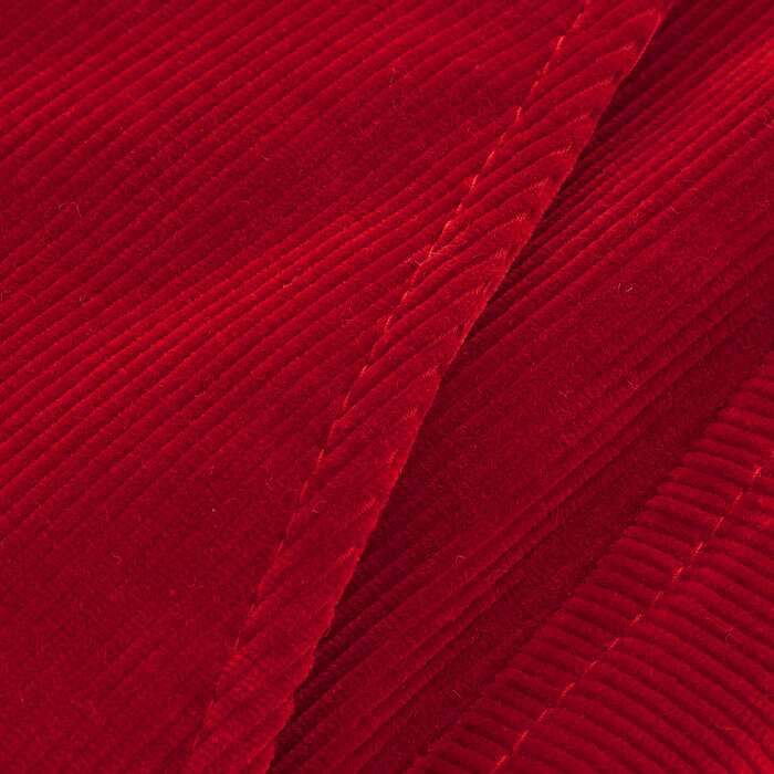 This velvet-touch fine cord is supersoft and drapey. In a rich red tone, this work-to-weekend solution is 100% cotton and features a modern black button for easy styling.