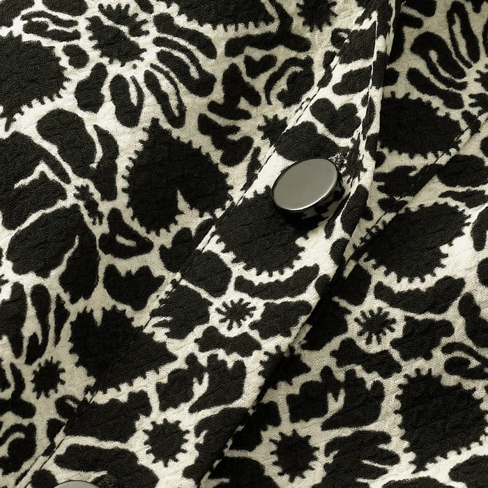 Drapey, supersoft and machine washable, this fabric features a bespoke Monochrome print that features floral silhouettes and playful graphic hearts. A contrast collar and cuff adds a menswear inspired edge.