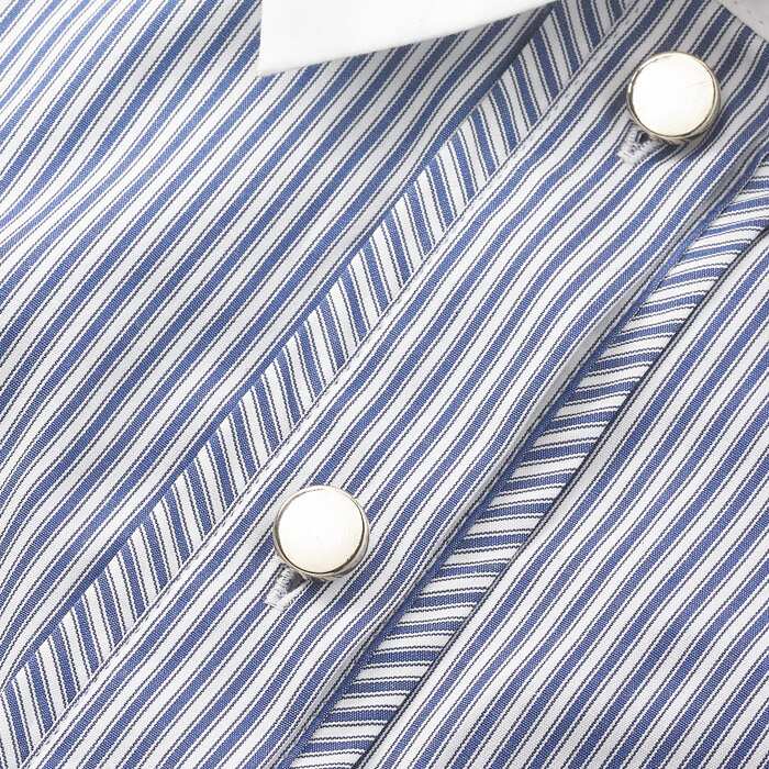 Cotton shirting featuring a classic fine stripe, this shirt has a menswear edge with a contrast white collar and cuff. This 100% cotton fabric features a soft sheen.