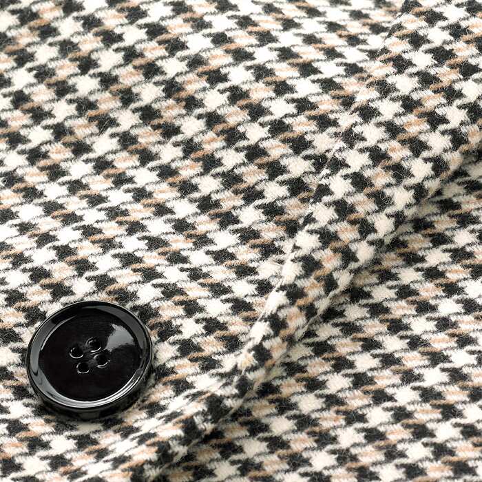 This eco-concious fabric is blended with recycled wool and EcoVero viscose. Featuring a neutral combination of black, cream and tan, this check is a versatile addition to your wardrobe. Fully lined for comfort.