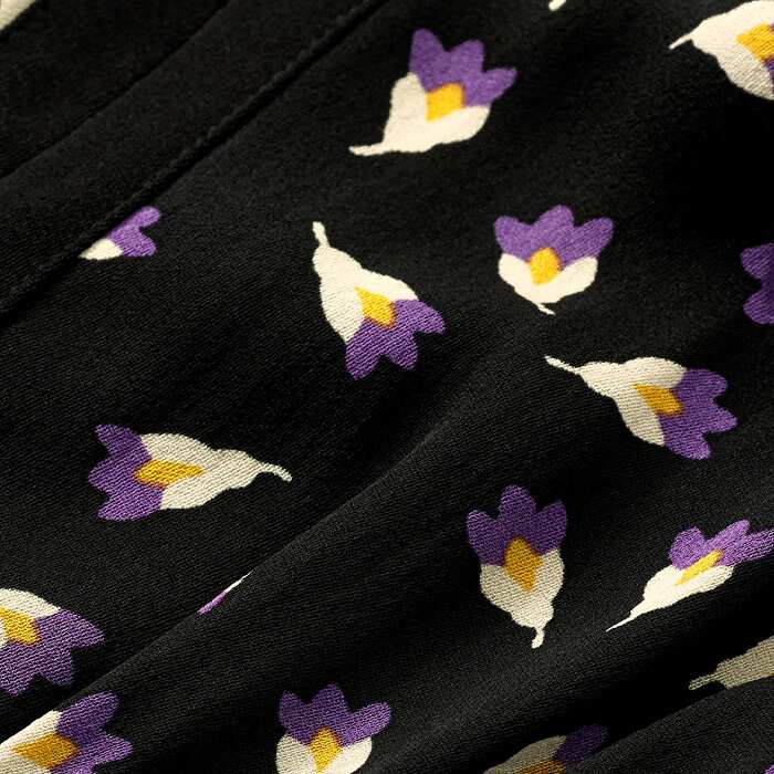 Crafted from 100% breathable viscose fabric in a Flower Bud print that combines vibrant yellow and violet. The style is framed and based with black for easy styling and is detailed with 100% Ecoverso sustainable lining.