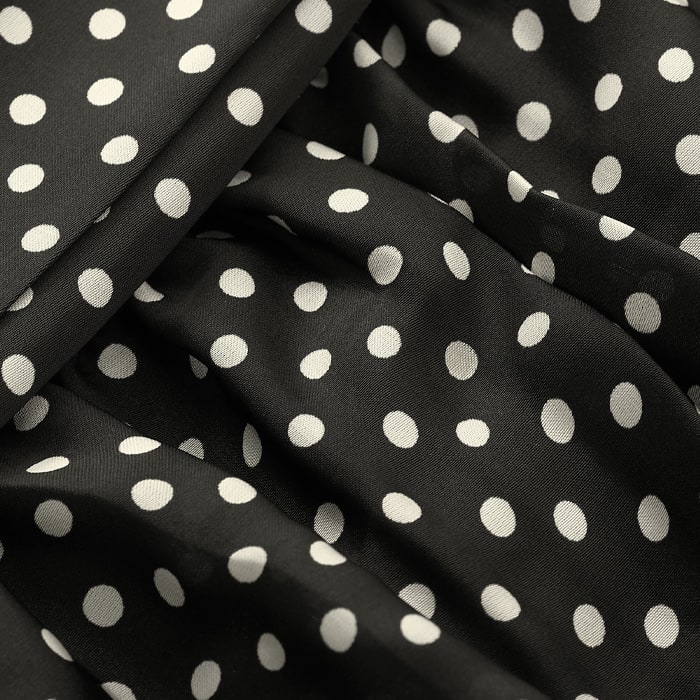 Defined by high shine, 100% recycled satin fabric with a classic polka dot print. This timeless fabric is supersoft and comfortable to wear. Fully lined.