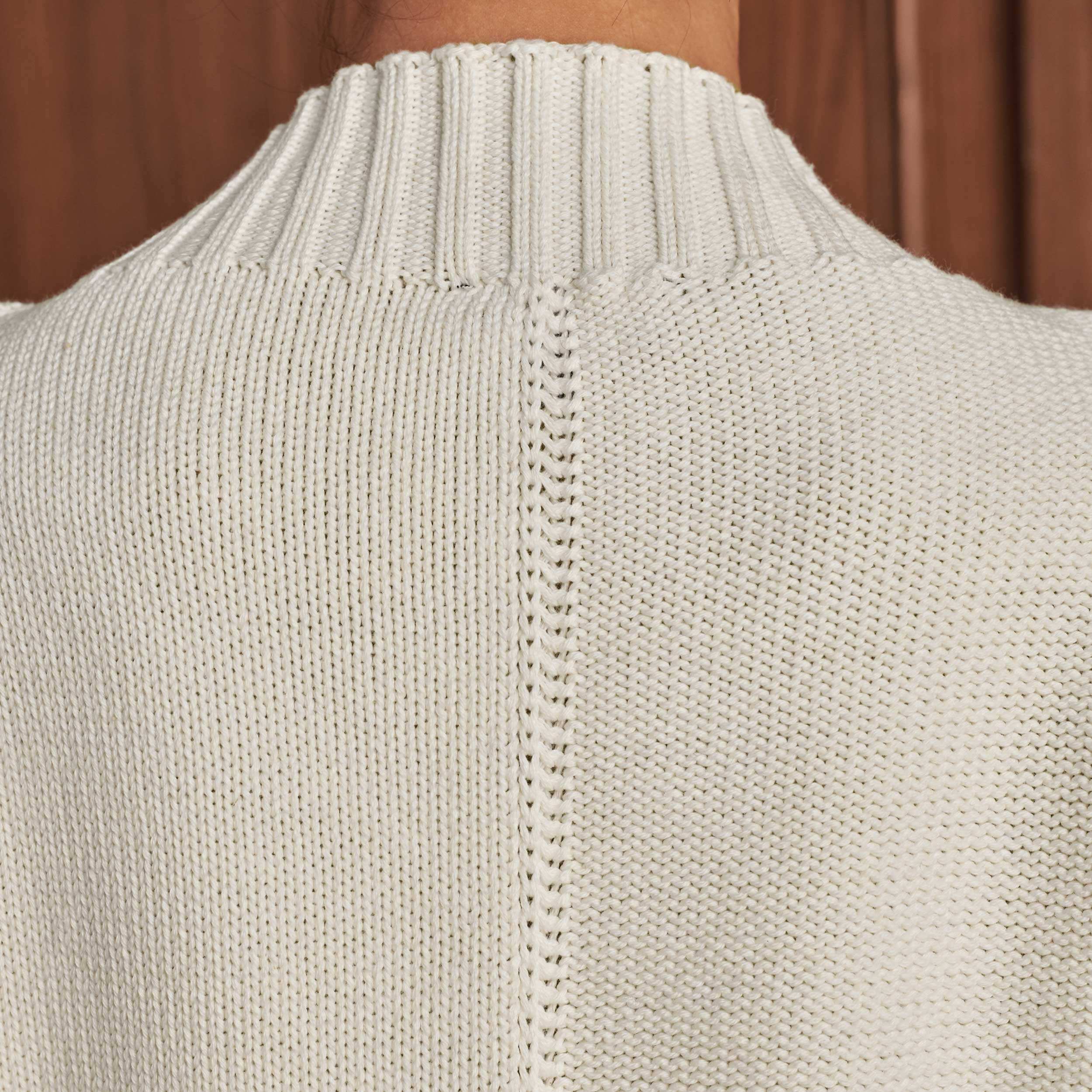 Panelling on both the front and back of the jumper are created using both sides of the fabric for an interesting texture clash.